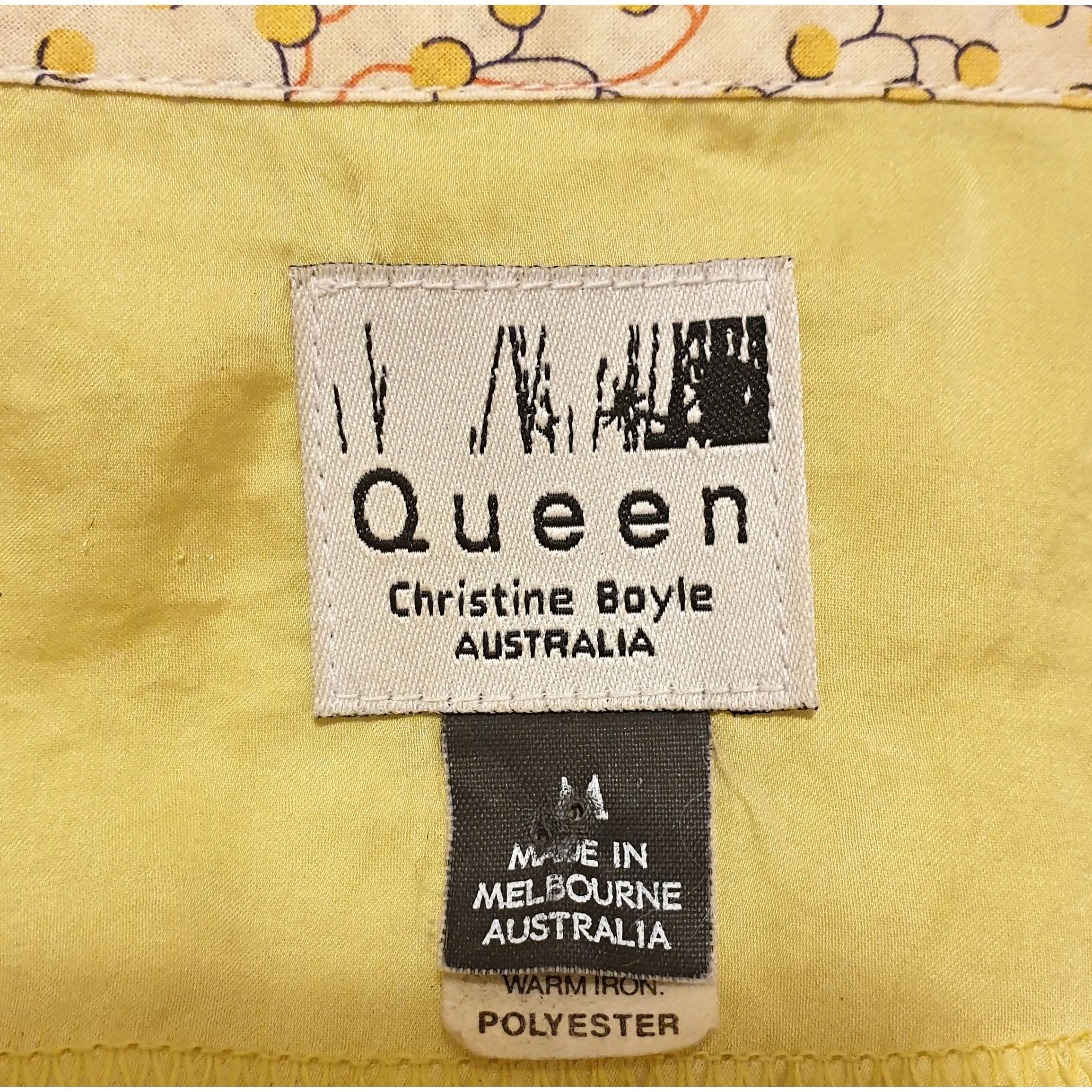 Queen yellow silky feel top with a pretty floral print detail size M (best fits size 12)
