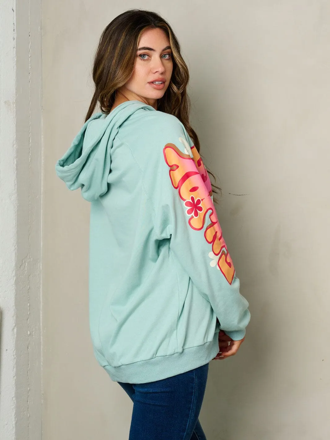WOMEN'S LONG SLEEVE HOODED GRAPHIC SWEATER